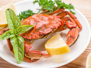 Cooked crab with lemon and herbs.