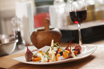Plate of vegetable salad and wine