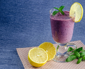 healthy food, fresh smoothies from currants and blueberries with lemon