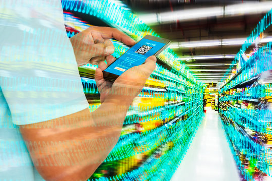 Digital revolution in retail market concept. Double exposure of business man using smart phone with shoping application on screen and abstract digital binary code with supermarket aisle,motion blur.