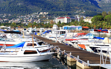 Fototapeta na wymiar Pier with moored boats and yachts