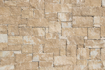 Light brown stone wall background texture 