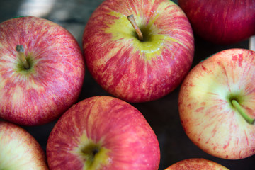 Ripe red apples on wooden background