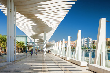 Sunny view of promenade near port of Malaga, Andalusia province, Spain.