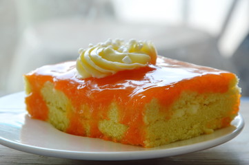 orange chiffon cake jam topping cream on dish