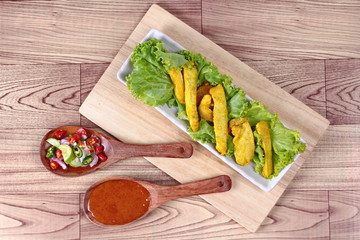 Charcoal boiled pork satay on butcher served , home made in big size, served with Thai cucumber chili sauce ( Ar Jad in Thai) and nut sauce are popular Asia cuisine. 
