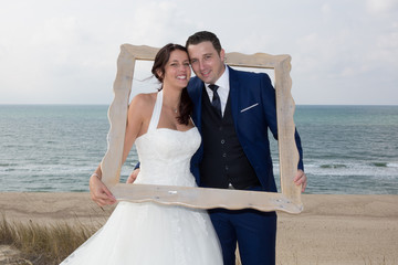 Wedding lovely couple in the frame at the sea