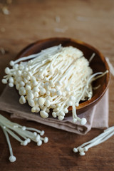 Enoki mushroom on old wooden table