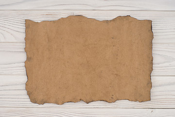 Old paper on an old white wooden table.