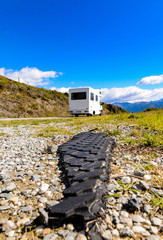 busted automobile tire at recreational vehicle in new zealand
