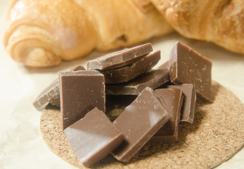 The chocolate on the background of croissants