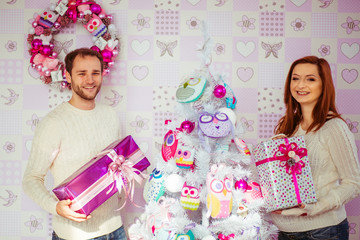 young couple doing a photo shoot in bright studios