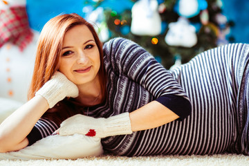 pregnant incredible woman lying on the floor