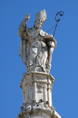 Statue of Saint Oronzo in Ostuni, Italy. Saint Oronzo is credited with protecting Ostuni from an 18th century famine. The statue stands atop a spire erected in 1771.
