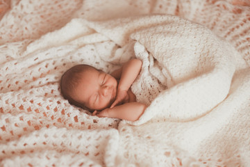 cute little baby is resting at home