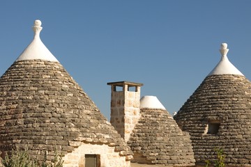 Fototapeta na wymiar Trulli trullo in Apulia (Puglia) Italy. These dry stone structures with a conical roof are specific to the Itria Valley. 
