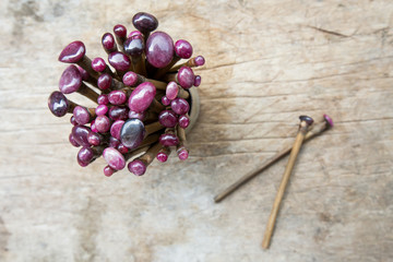 gemstone with wax and dop sticks on old wooden table