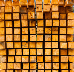 Wall of square log wood, wooden square section, wooden abstract background, pile of timber logs, wood square texture background