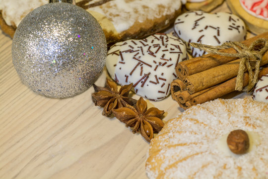 Christmas cookies festively decorated and Christmas silver ball
