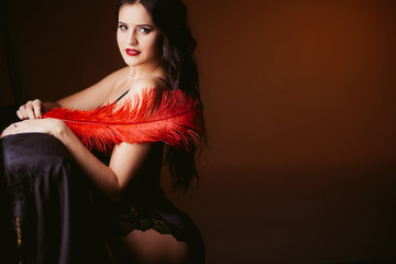 sexy woman in beautiful underwear makes home photo shoot