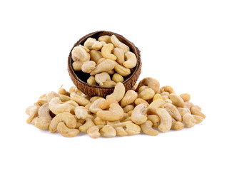 Cashew nuts in wooden bowl isolated on white background