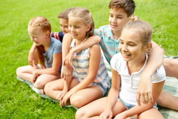 Fototapeta premium group of happy kids or friends outdoors