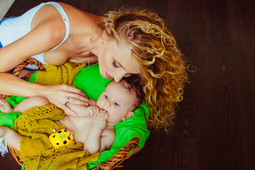 beautiful mother holding a child's hand