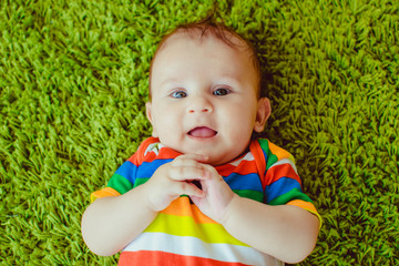 wonderful little  boy showing tongue at the camera