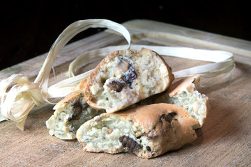 Traditional Italian food. Sweet biscuits cantucci with almonds. Dark wood background