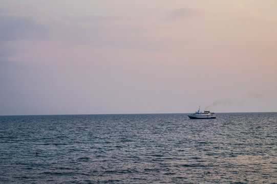 The ship in the evening calm sea