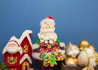 Christmas or New Year background: fur-tree, branches, gifts, colored glass balls, decoration and cones on a white, blue background