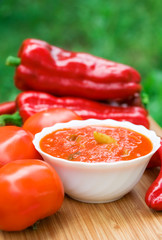 Hot peppers in tomato sauce with herbs and garlic
