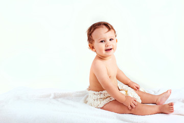joyful little boy sitting on the couch