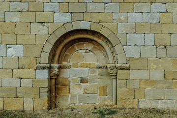 seen a dazzled door of the Romanesque church of san Martin Obispo in the Matalbaniega town in Palencia, Castile and León, Spain