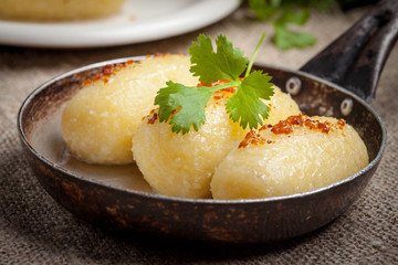 Potato dumplings stuffed with minced meat.