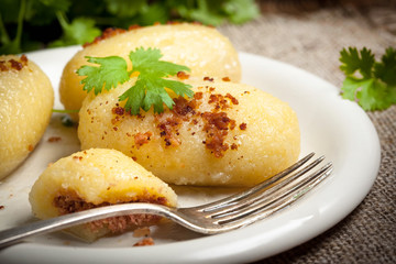 Potato dumplings stuffed with minced meat.