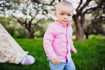 Handsome little man in a pink shirt