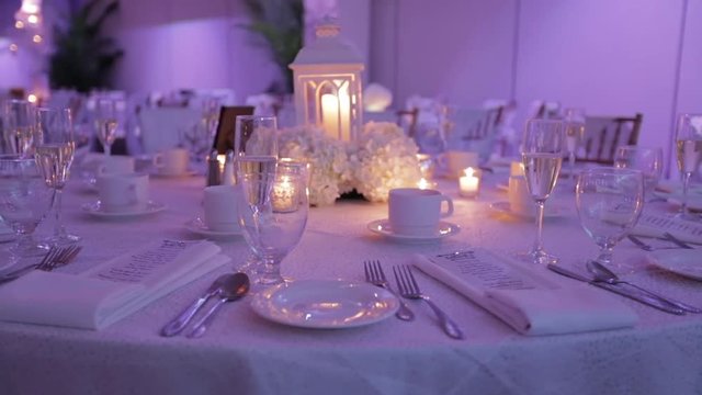 Wedding reception visuals, Decorative table setting pan with candle lights at a wedding reception.