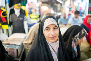 Beautiful Muslim woman spending time on traditional Iranian baza