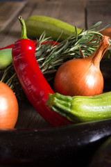 Different kind of local vegitables on the wooden rustic table. Organic food concept