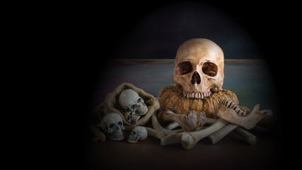 Skull and pile of bones in the dark Halloween night