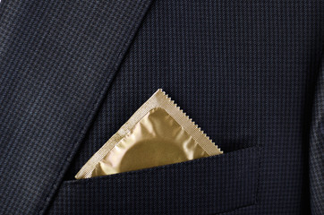 condom in the pocket suit jacket close-up horizontal