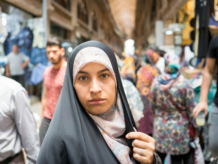 Beautiful Muslim woman spending time on traditional Iranian baza - obrazy, fototapety, plakaty