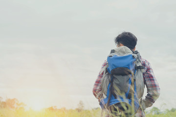 Man  travel  backpack relaxing outdoor on background Summer vaca