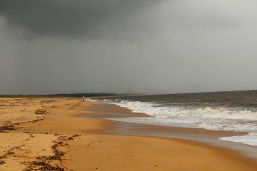 Fototapeta na wymiar Rain Arriving at the beach.