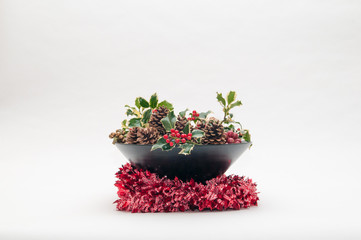 Festive Christmas decoration with holly and ivy on a white background