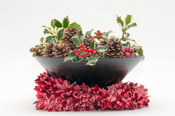 Festive Christmas decoration with holly and ivy on a white background