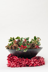 Fototapeta premium Festive Christmas decoration with holly and ivy on a white background