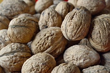 Macro detail of a heap of nuts (walnuts) as a symbol of healthy snack and organic food 