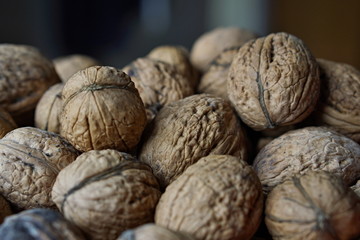 Macro detail of a heap of nuts (walnuts) as a symbol of healthy snack and organic food 